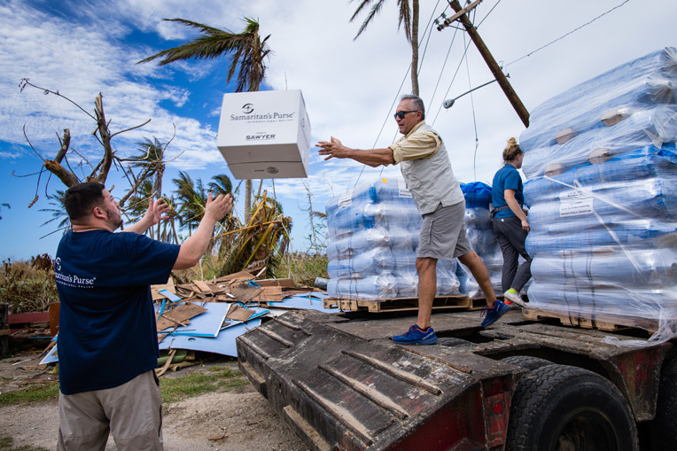 Relief workers unloading water and emergency supplies in the Mariana Islands